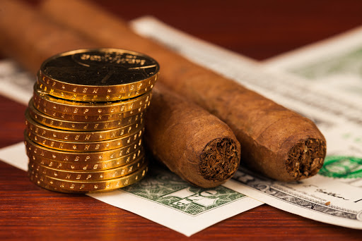 Gold, Dollars and cigars &#8211; es