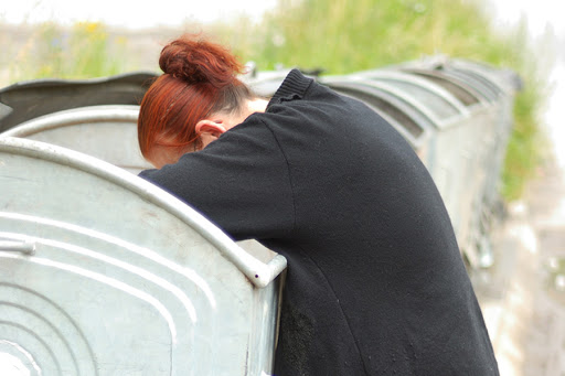 Poverty, middle aged woman searching container &#8211; es