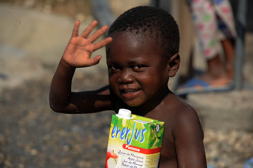 HAITI, Port-au-Prince : A boy waves &#8211; es