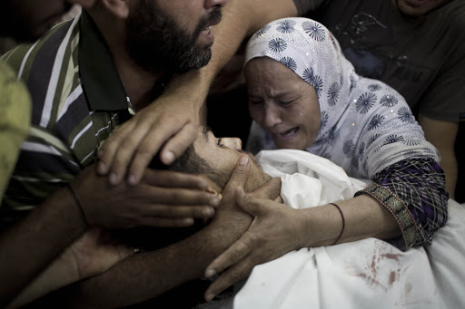 BEIT LAHIYA : A Palestinian mother mourns over the body of her son &#8211; es