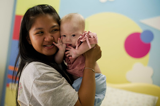 THAILAND, Siriracha : Thai surrogate mother Pattaramon Chanbua (L) holds her baby Gammy &#8211; es