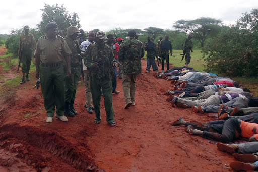 Mandera-Kenya / security forces walking near bodies of victims killed in a dawn attack on a bus &#8211; es