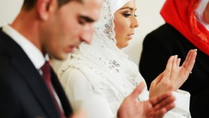 Muslim bride and groom at the mosque during a wedding ceremony