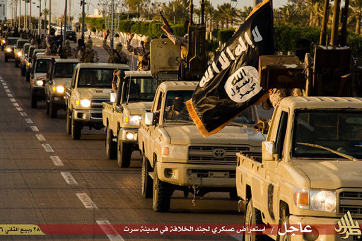 Members of the Islamic State (IS) militant group parading in a street in Libya&#8217;s coastal city of Sirte &#8211; es