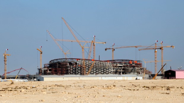 web-soccer-qatar-stadium-build-desert-2022-cup-shutterstock_172383152-philip-lange-ai.jpg