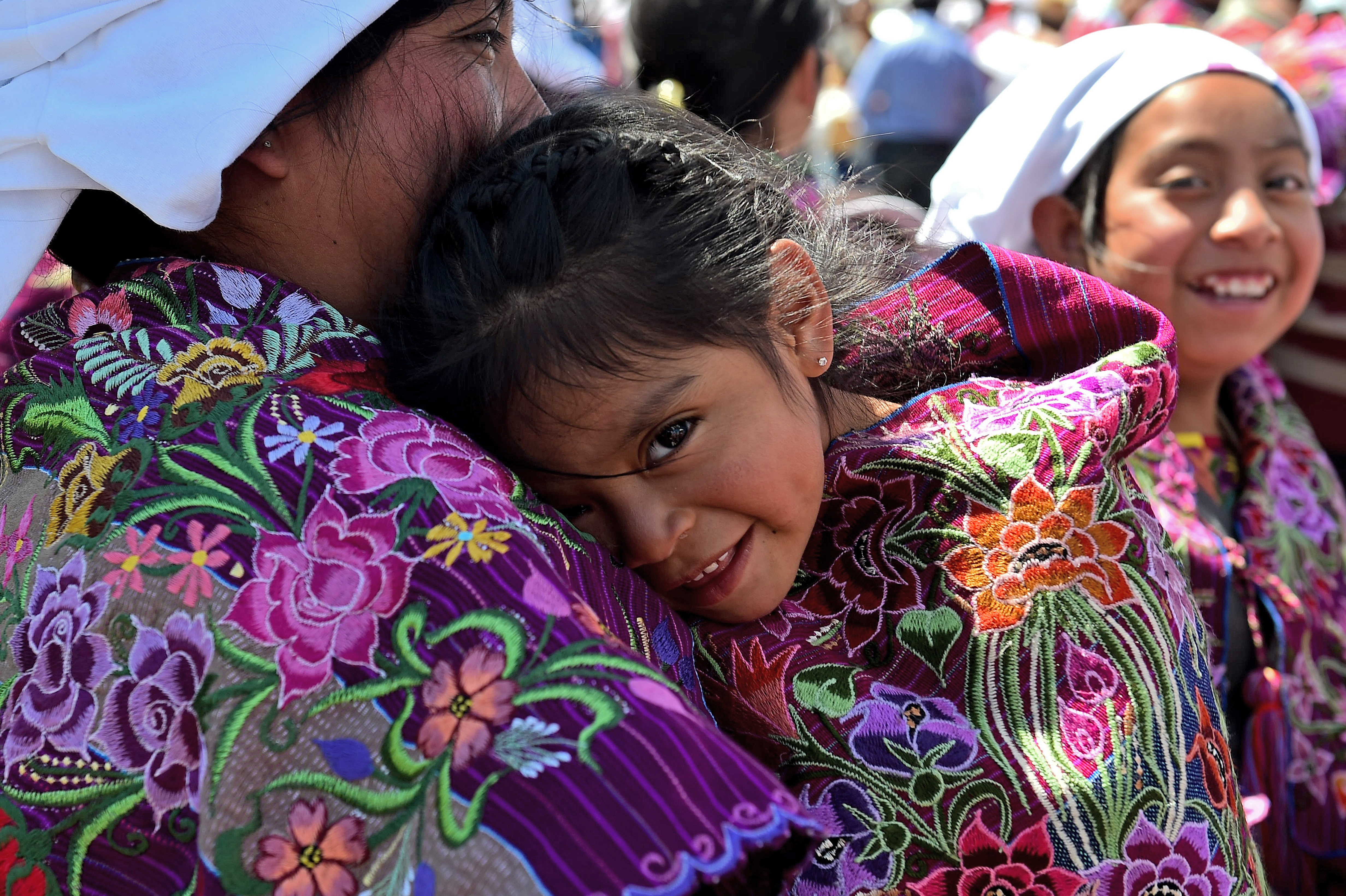 A young girl attends a mass celebrated by Pope Francis with representatives of the indigenous communities of Chiapas in the municipal sport center in San Cristobal de Las Casas, Chiapas, Mexico on February 15, 2016. Pope Francis reached out to Mexico's long-marginalized indigenous population on Monday, asking for forgiveness over their exclusion as he celebrated an open-air mass in native languages in impoverished Chiapas state.   AFP PHOTO / GABRIEL BOUYS / AFP / GABRIEL BOUYS