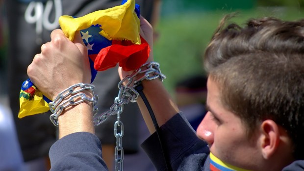 web-venezuela-march-protest-freedom-man-flag-carlos-dc3adaz-cc.jpg
