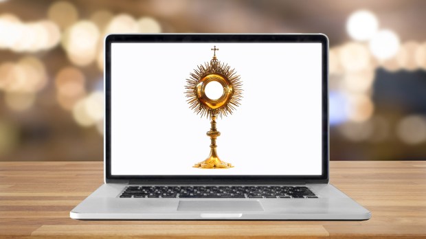 web-eucharist-adoration-laptop-online-shutterstock_384674077-charts-and-bg-c12-ai.jpg
