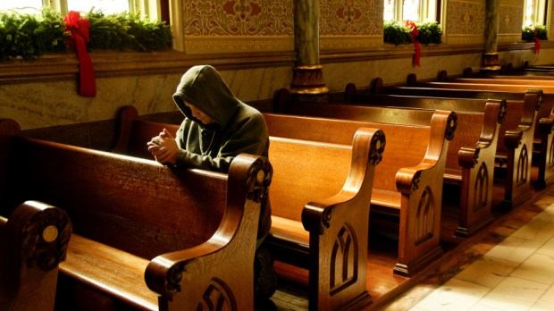 web-person-praying-knees-church-waddell-imagesshutterstock-cc.jpg