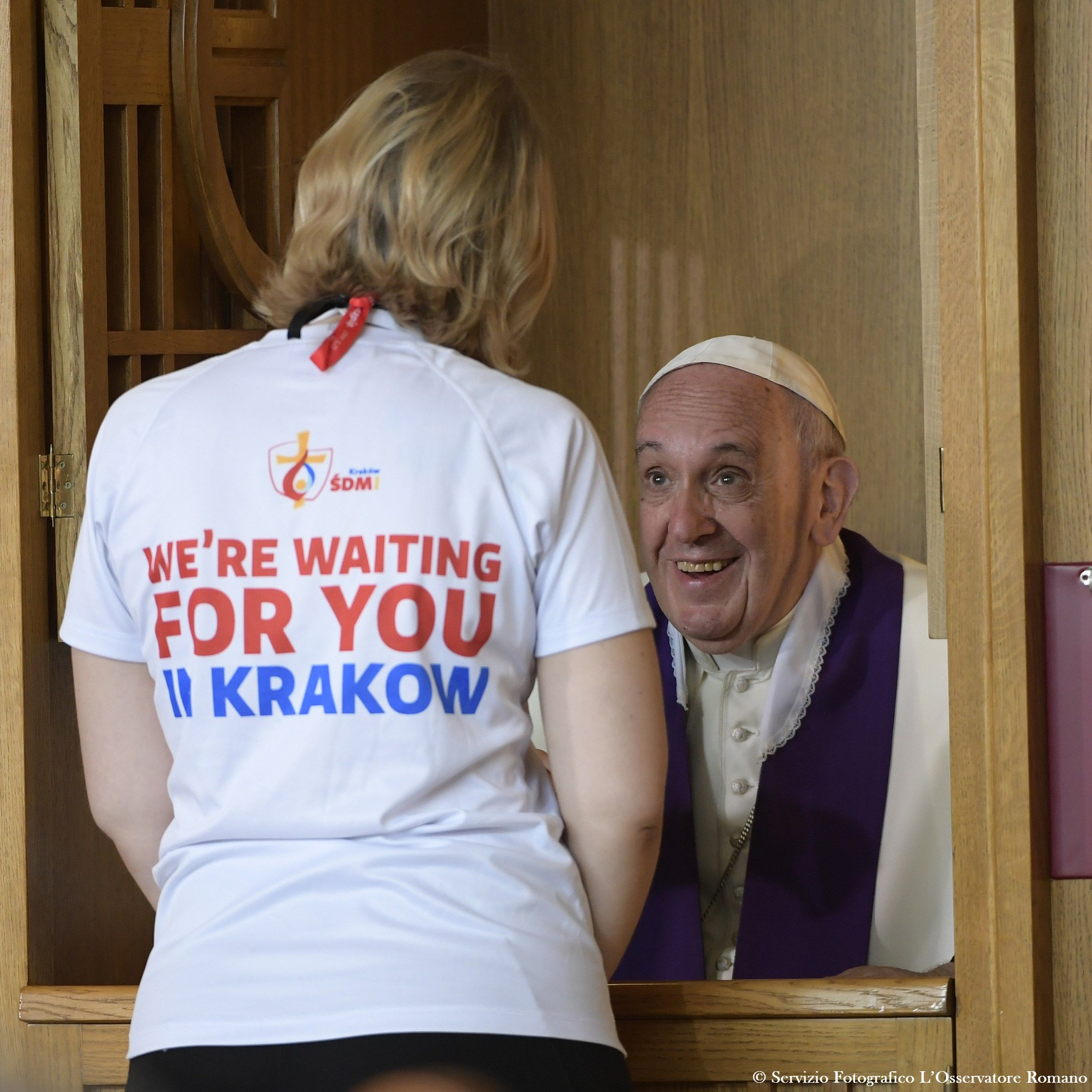 This handout released by Osservatore Romano shows Pope Francis confesseing a youth at the Divine Mercy Sanctuary on July 30, 2016 in Krakow-Lagiewniki as part of the World Youth Days (WYD). Pope Francis is in Poland for an international Catholic youth festival with a mission to encourage openness to migrants. HO / OSSERVATORE ROMANO / AFP