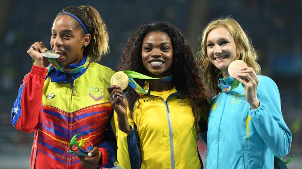 web-olympics-ibarguen-colombia-gold-medal-podium-000_ex4bq-johannes-eisele-afp-ai.jpg