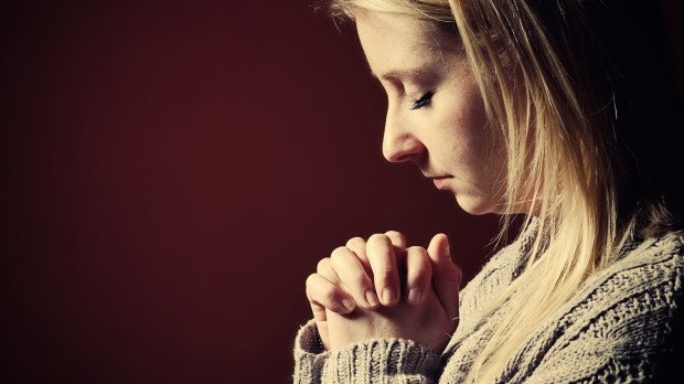 web-pray-woman-prayer-hands-shutterstock_259169045-itsmejust-ai