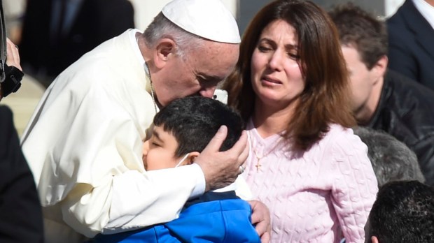 Topshots A sick Boy hug&#8217;s Pope Francis