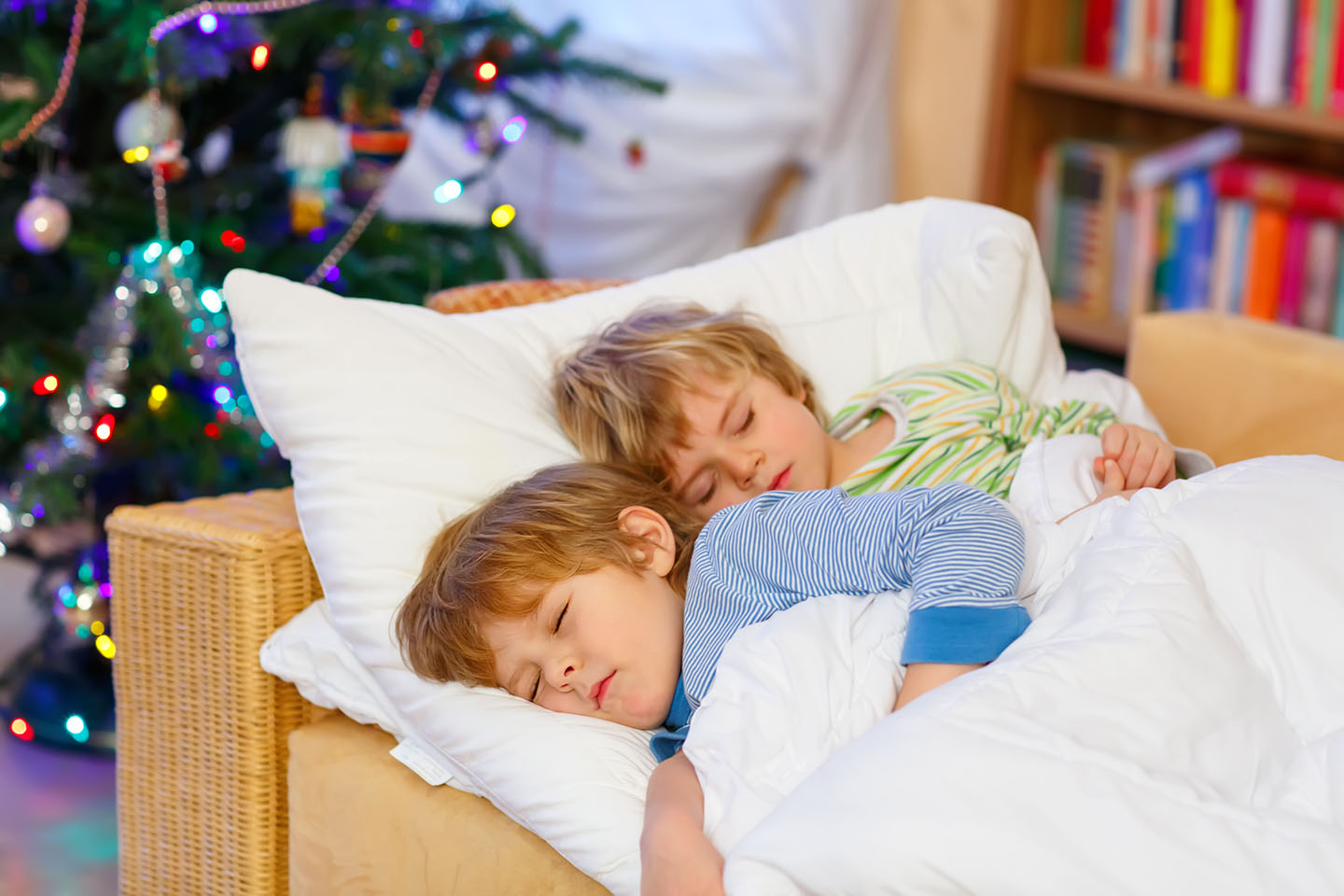 web-siblings-sleeping-bed-shutterstock_495907156-romrodphoto-ai