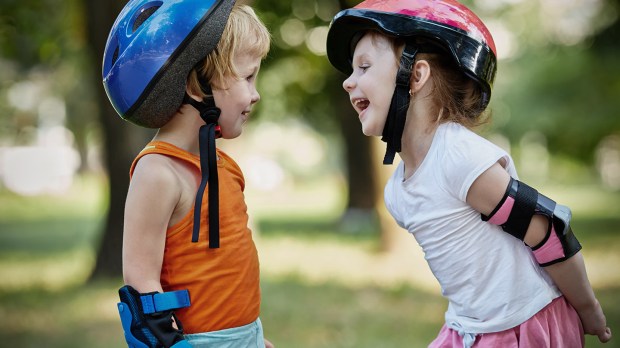 web-childrem-looking-smile-helmet-shutterstock_156263213-pavel-l-photo-and-video-ai