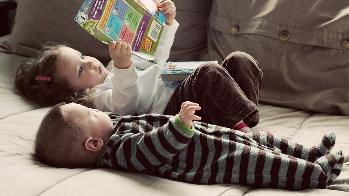 web-children-laying-down-young-reading-book-thomaslife-cc