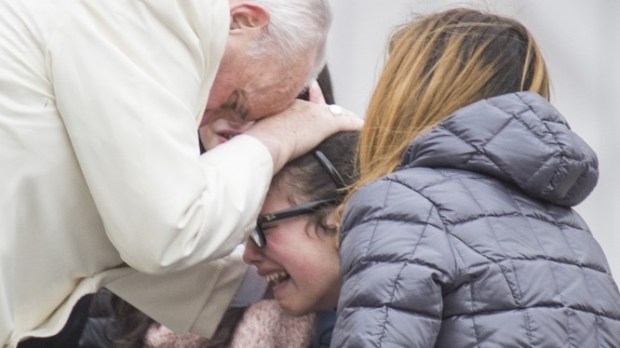 Pope francis blessing a sick girl
