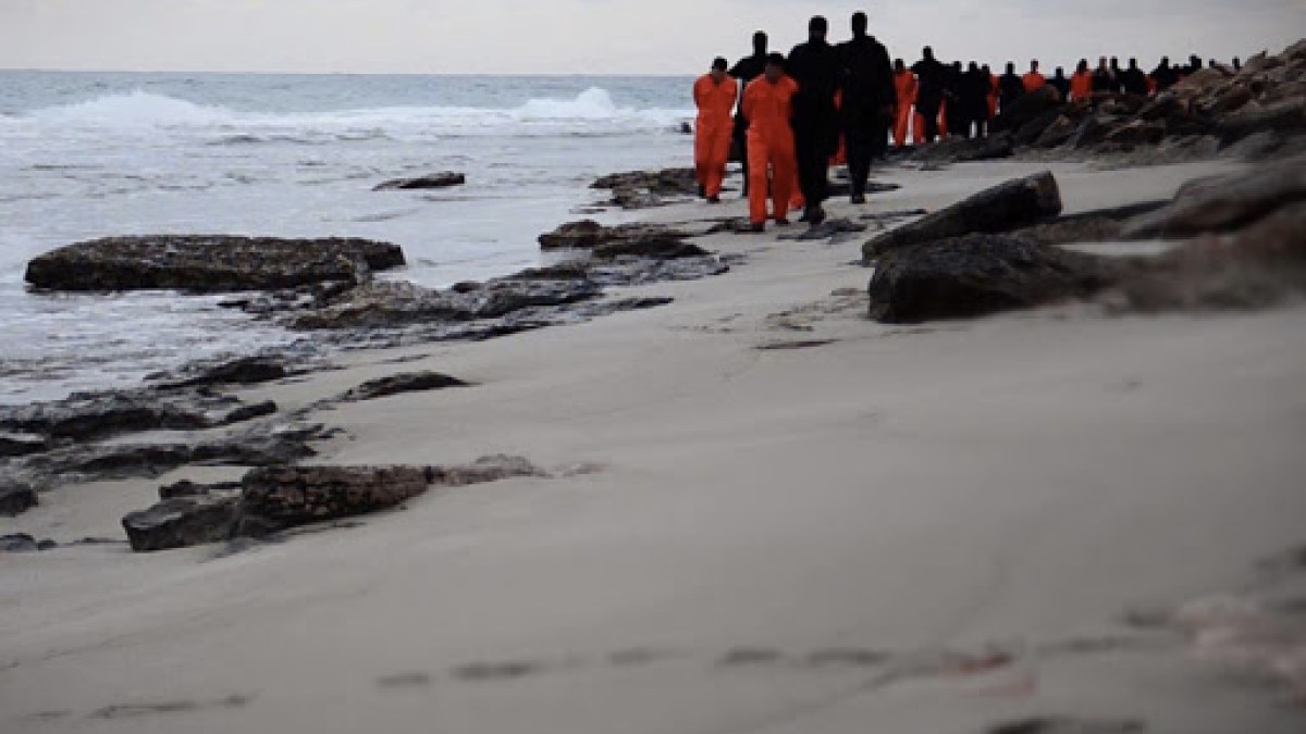 Islamic State (IS) group fighters leading handcuffed hostages, said to be Egyptian Coptic Christians