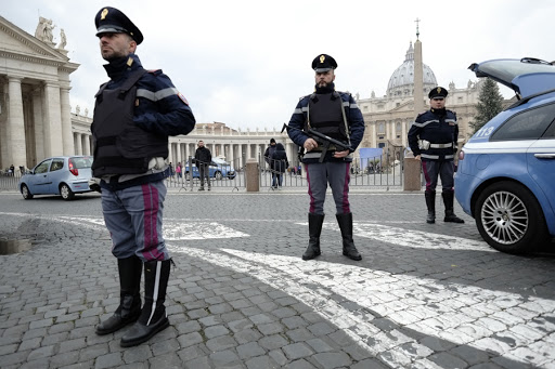 Italian policemen stand guard near the Vatican on January 8, 2015 in Rome.