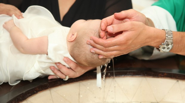 WEB BAPTISM BABY PRIEST HANDS © Antonio Gravante Shutterstock