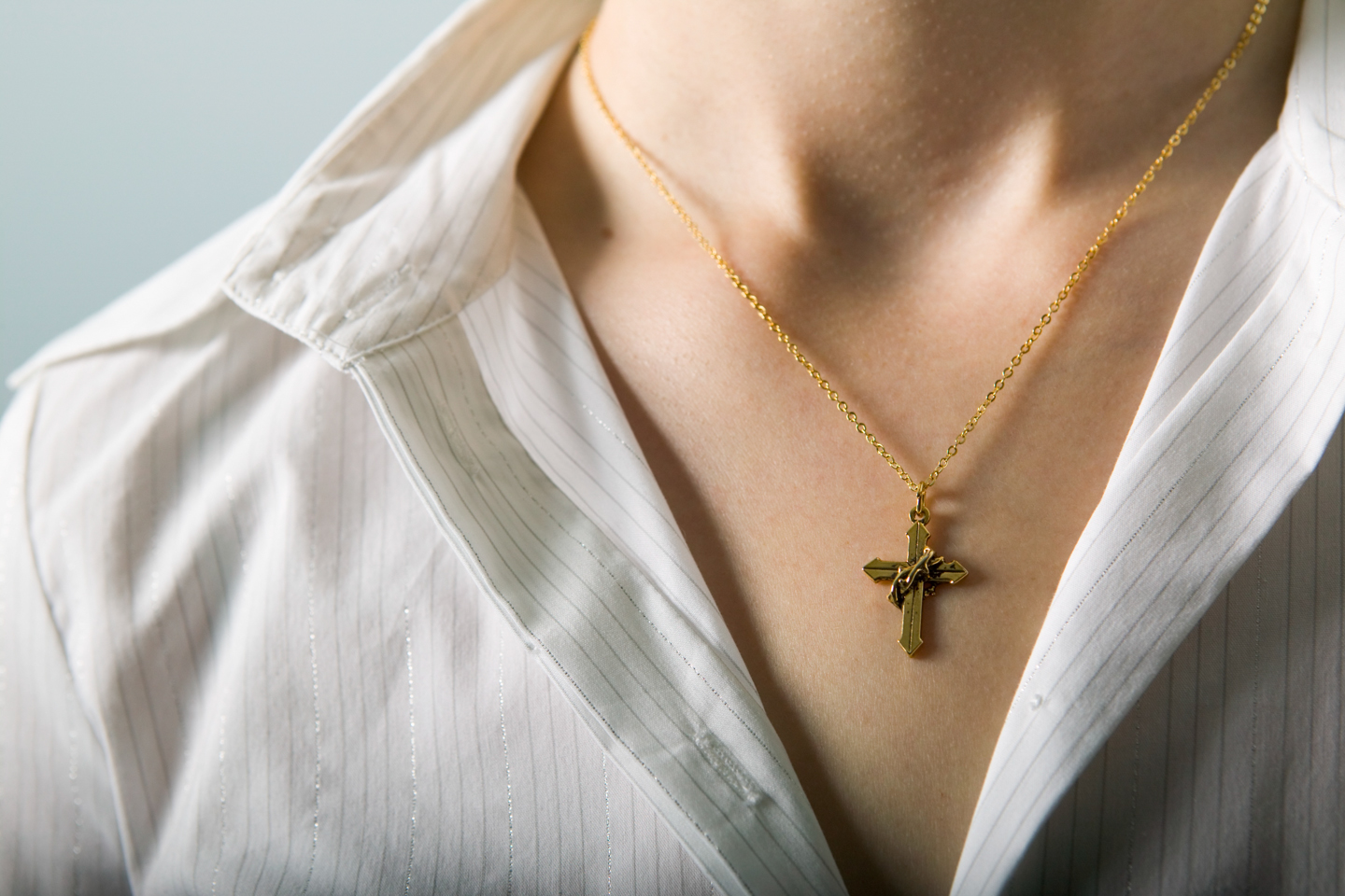 Woman wearing cross necklace