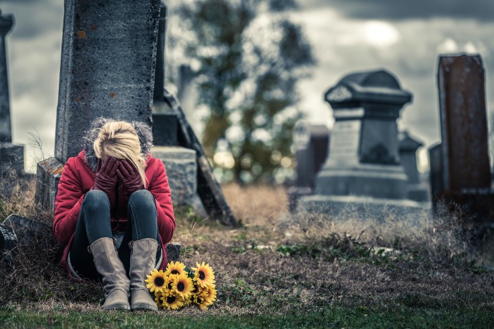 web-death-woman-crying-cemetary-benoit-daoust-shutterstock_328914971