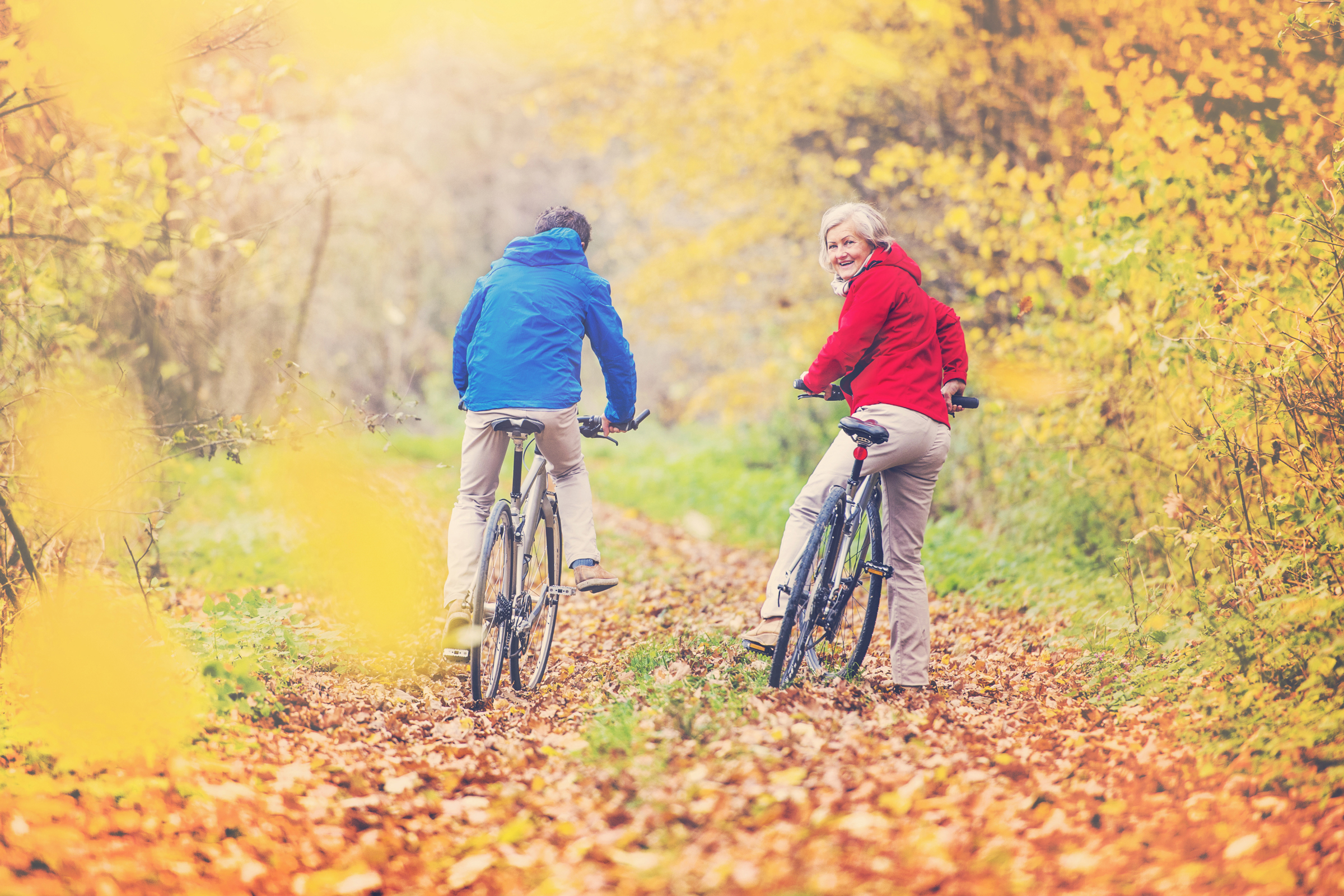 WEB-SENIOR-COUPLE-RIDING-BIKE-Halfpoint-Shutterstock_232738231