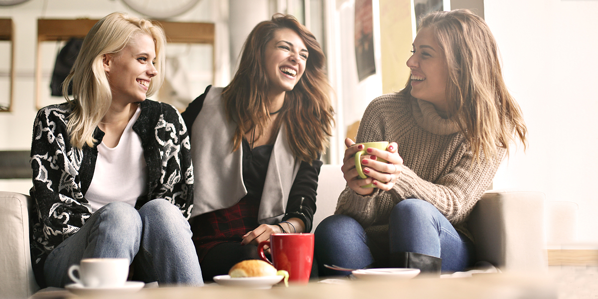 WEB3 WOMEN COFFEE LAUGHING FRIENDS Shutterstock
