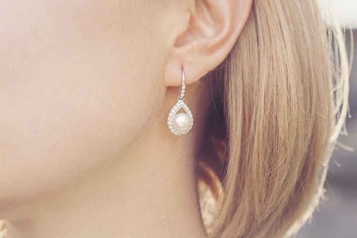 Detail of young woman wearing beautiful luxury earring