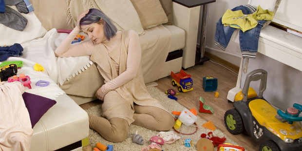 web3-frustrated-mom-toys-living-room-couch-sad-depressed-messy-clutter-shutterstock