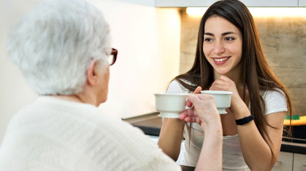WEB3 MOM AND DAUGHTER COFFEE TEA CONVERSATION MENTOR Shutterstock