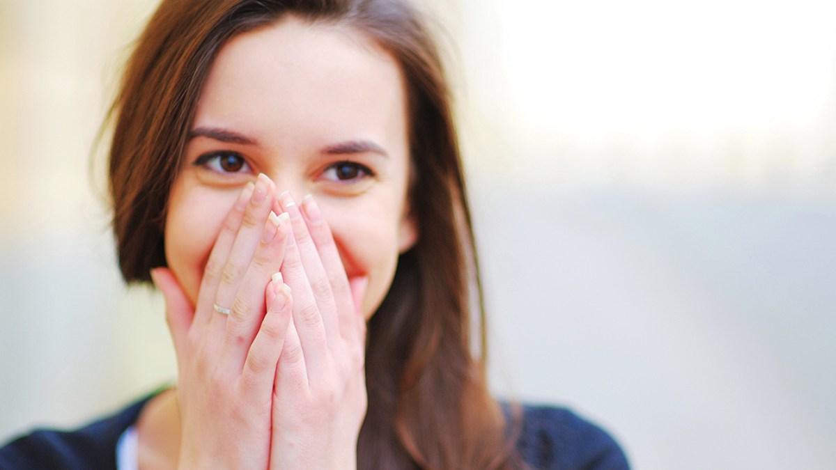 web3-woman-shy-shame-smile-sun-ok-shutterstock