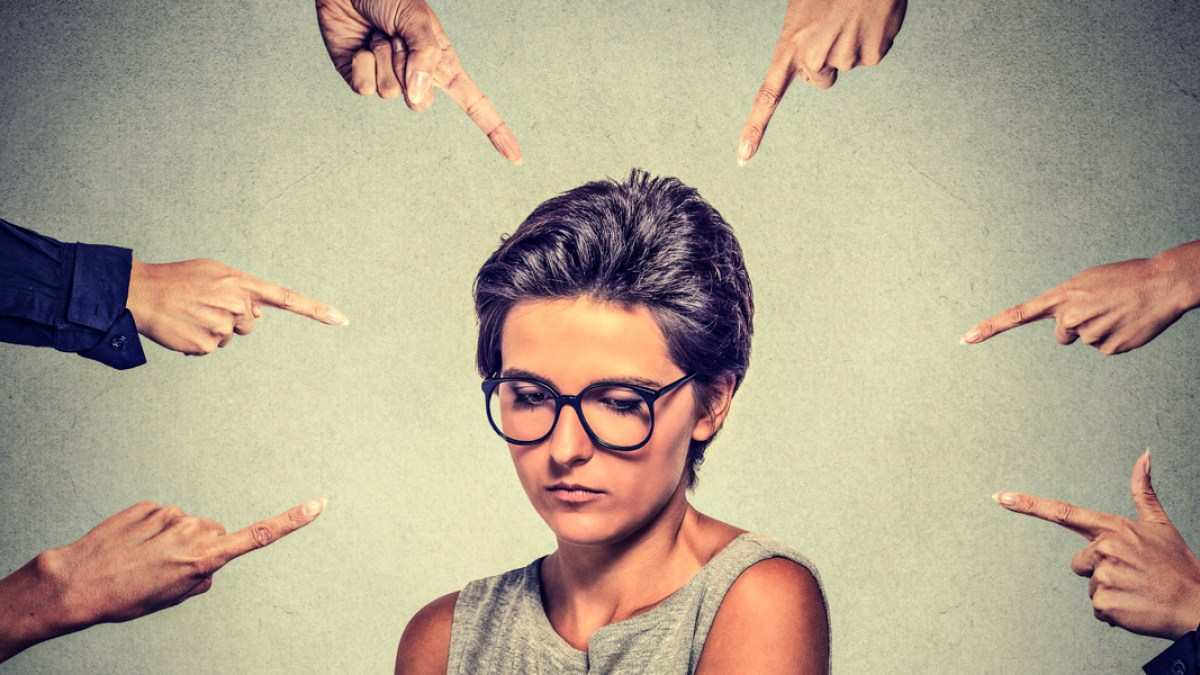 WEB3 HUMILITY WOMAN CROWD POINTING Pathdoc shutterstock_362269424