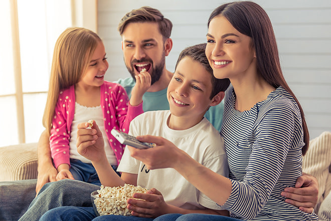 web3-family-watching-tv-television-smile-shutterstock