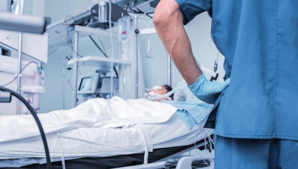 PATIENT IN HOSPITAL BED