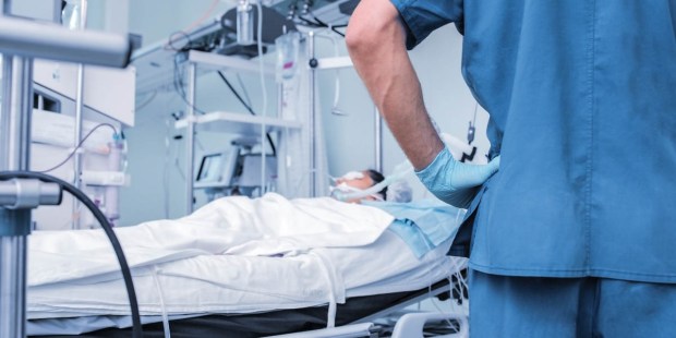 PATIENT IN HOSPITAL BED