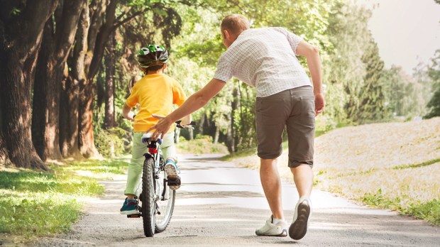 web3-dad-child-kid-father-bike-bicycle-training-wheels-park-path-shutterstock