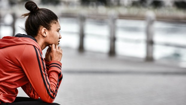 YOUNG WOMAN LOOKING OUT