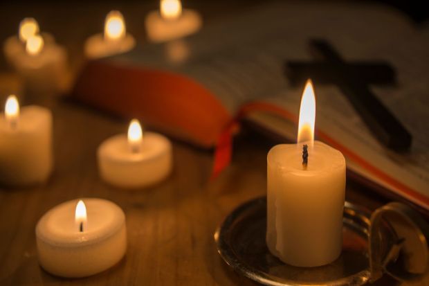 Bible with candles