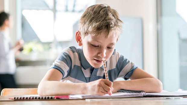 BOY DOING HOMEWORK