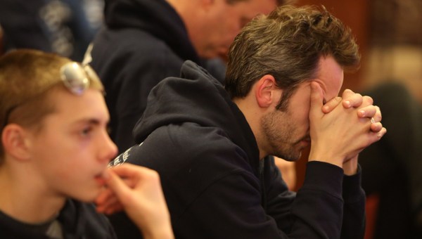 MAN,PRAYING,CATHOLIC,MASS