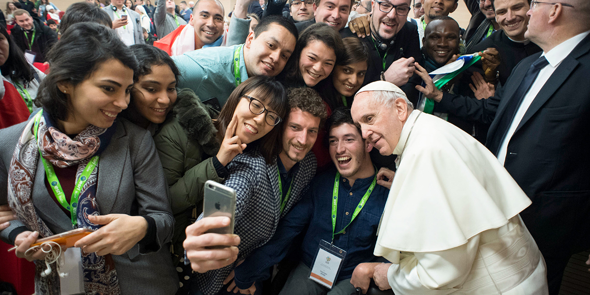 POPE FRANCIS GREETS YOUNG PEOPLE DURING A PRE-SYNODAL MEETING