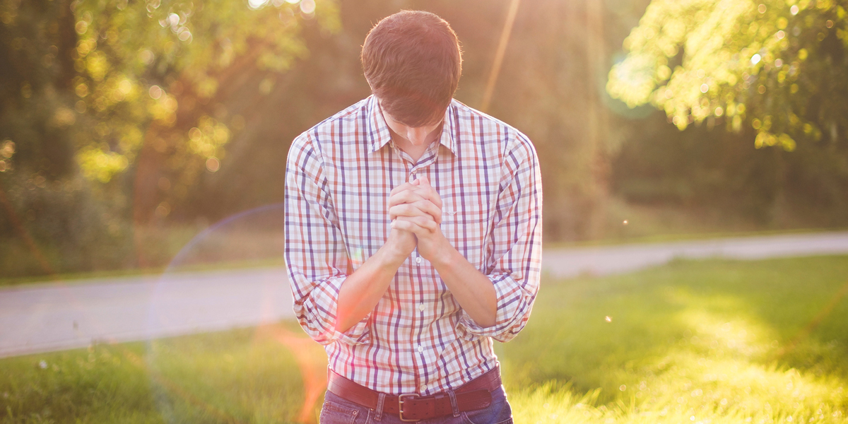 YOUNG,MAN,PRAYING
