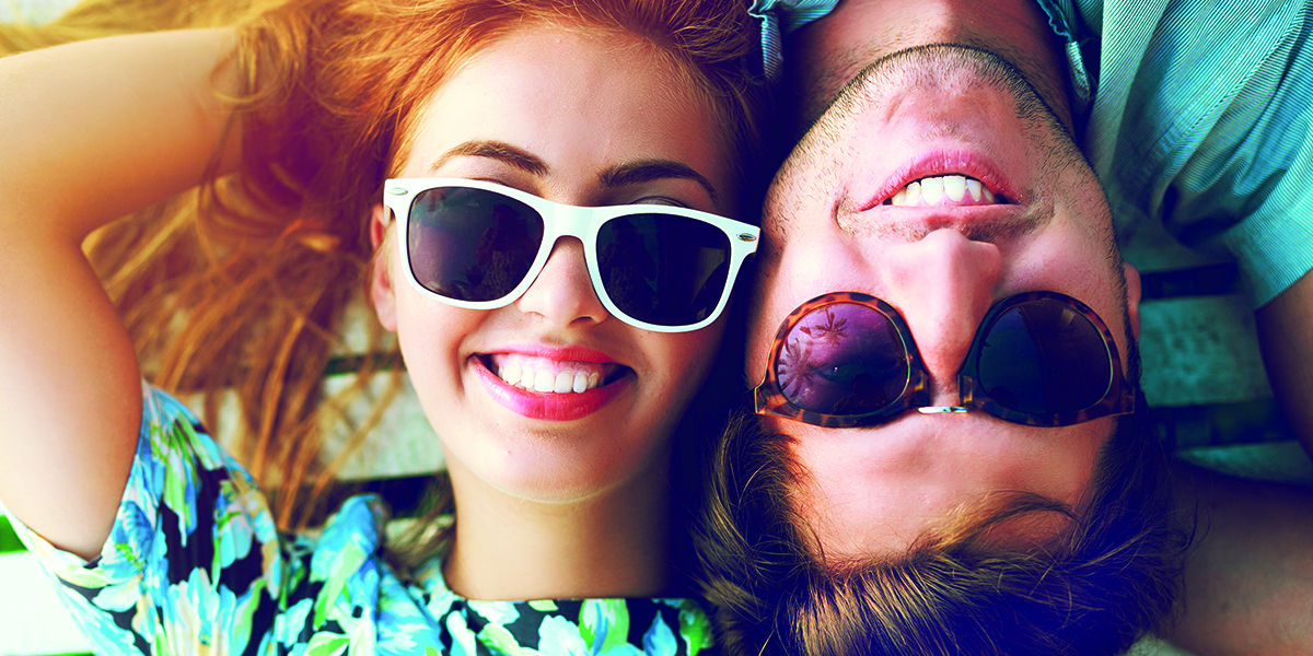 Happy couple portraits wearing sunglasses