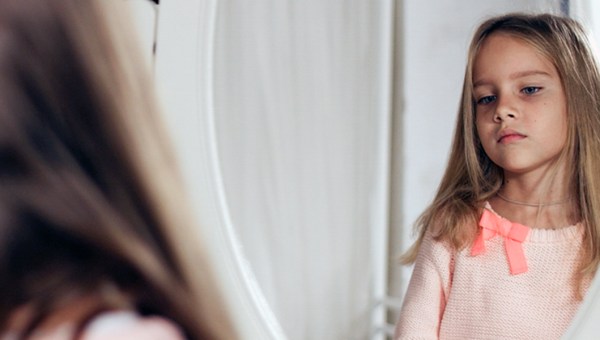 CHILD LOOKING AT REFLECTION