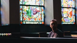 YOUNG,MAN,PRAYING,CHURCH