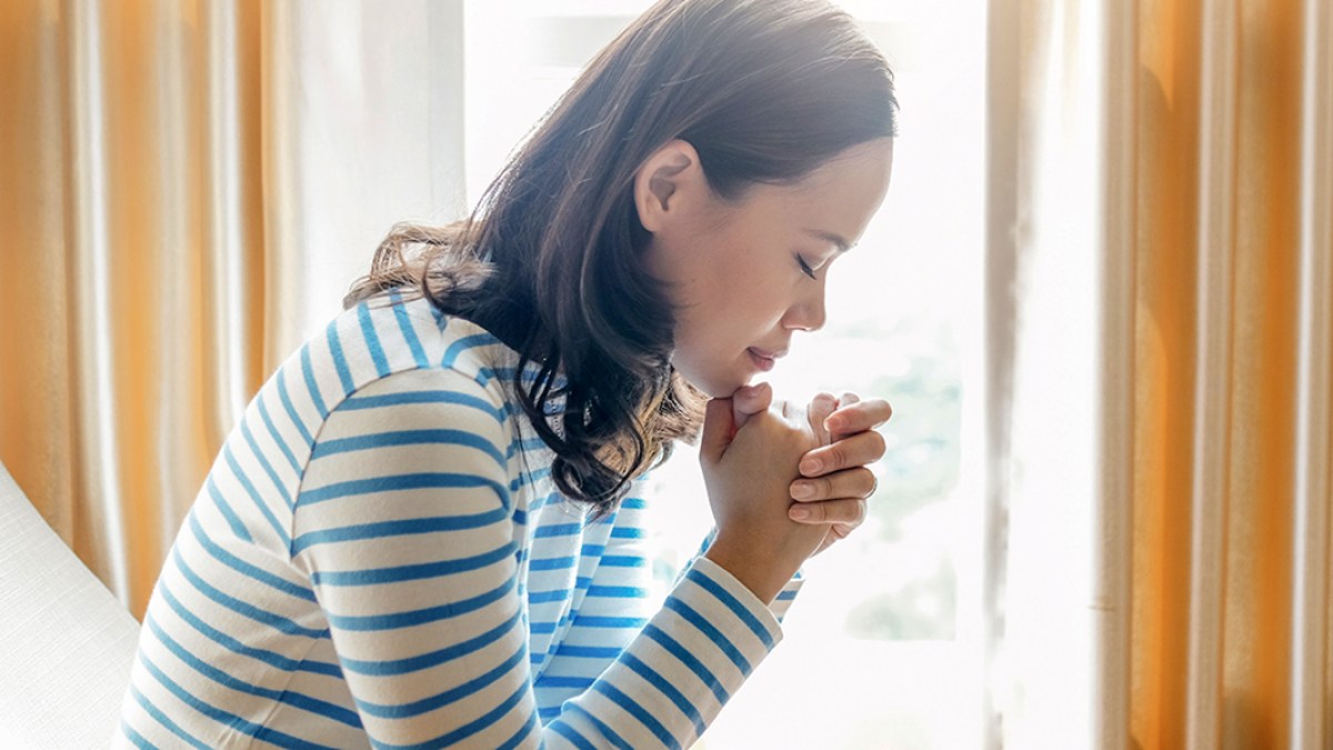 WOMAN PRAYING