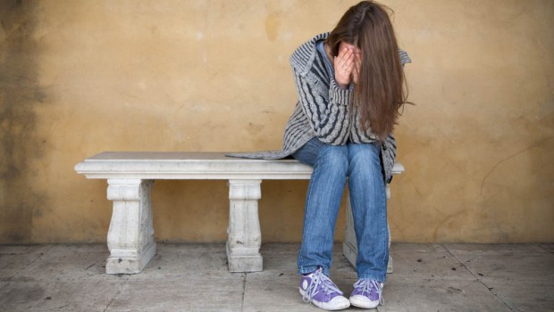 GIRL SITTING ALONE