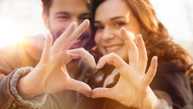 Couple meaking a heart