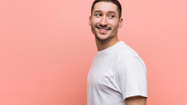young casual man smiling